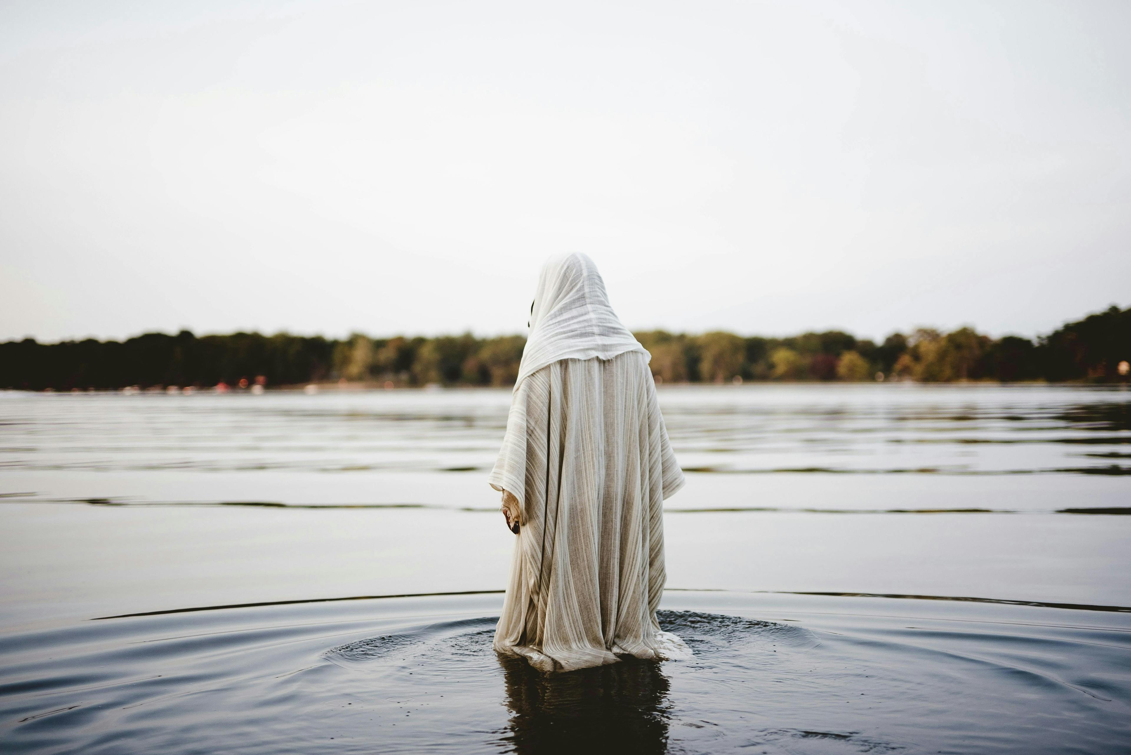 Man in robe in water
