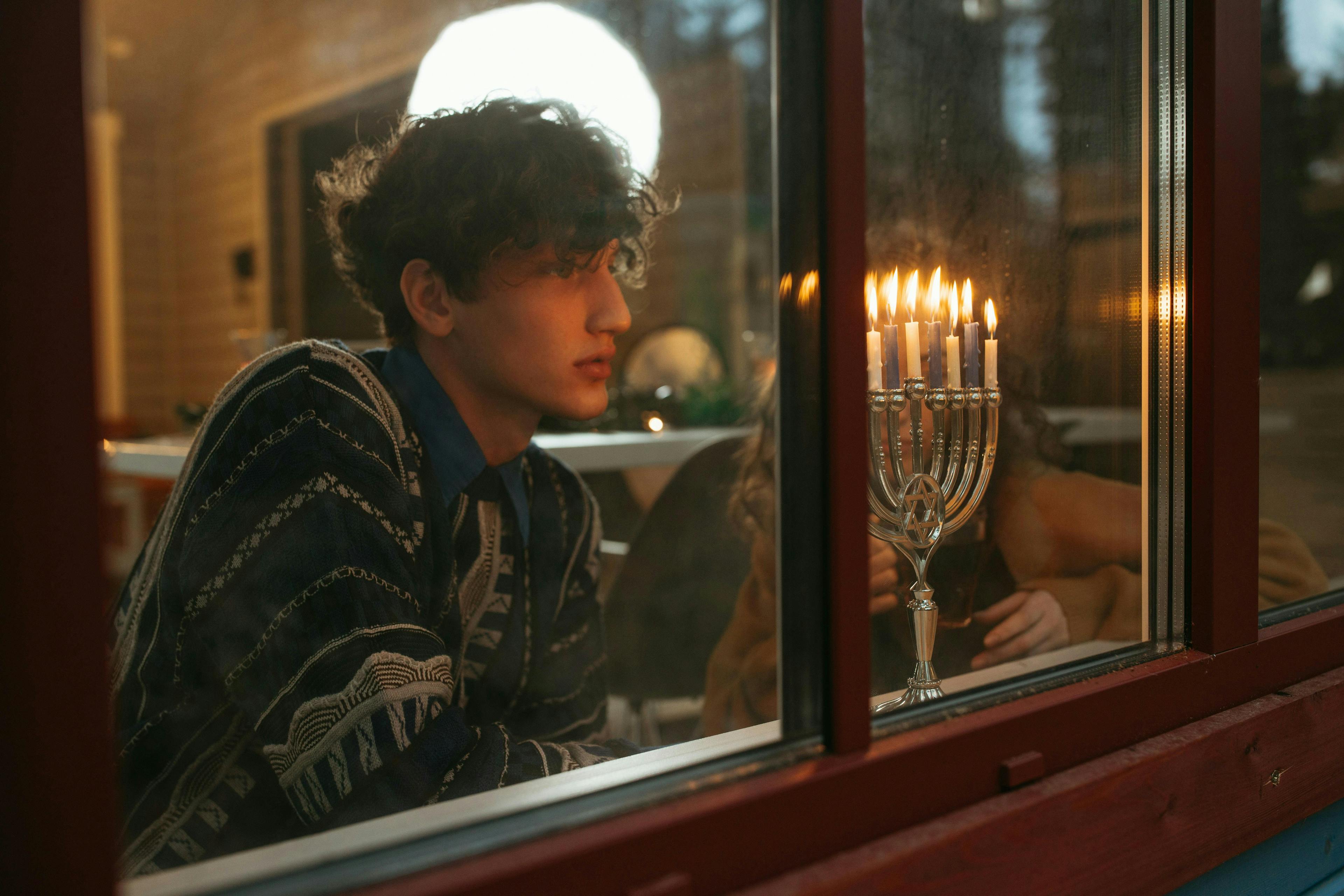 Jewish guy looking out window